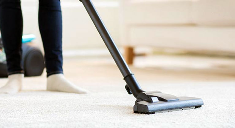 vacuuming the floor